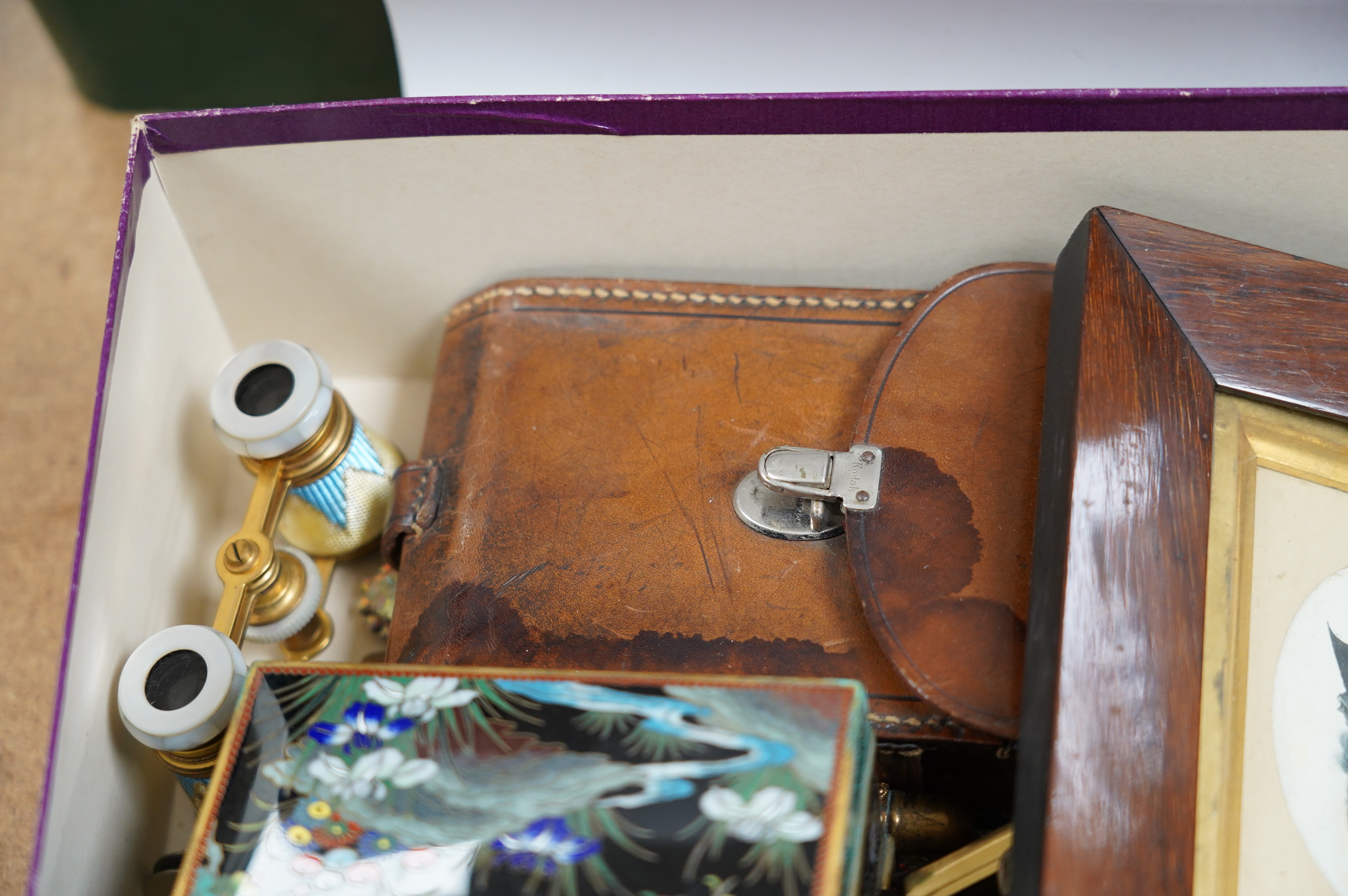 A Japanese cloisonné enamel cigarette box, early 20th century, a leather cased 1930's camera, a pair of enamelled opera glasses etc. condition - fair